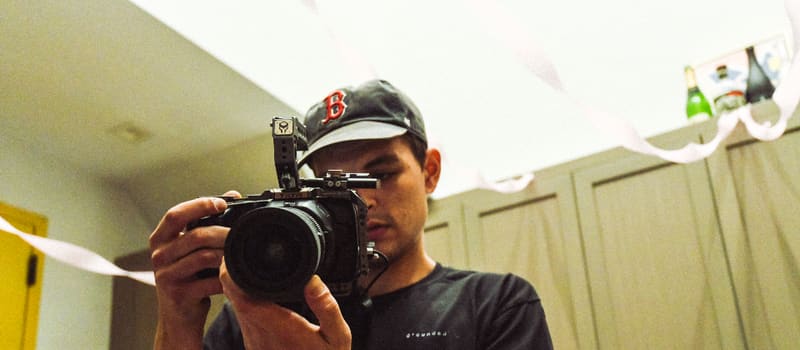 A man holding a video camera