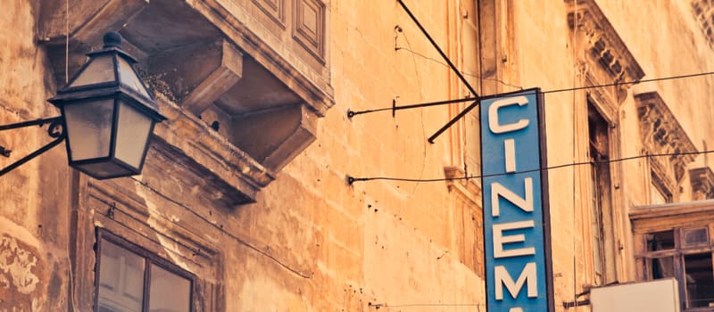 An illuminated cinema sign